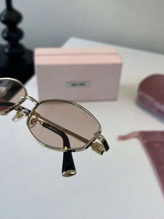 Miu Miu Cat-Eye Sunglasses with Gold Frames and Pink Lenses - Picture 7 of 7